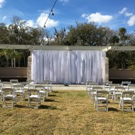 White Sheer Drape & White Garden Chairs