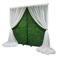 Boxwood Hedge Wall & White Sheer Drape